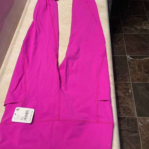 Free people movement wave rider leggings has pockets. Magenta size xs - Picture 11 of 11